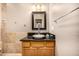 Bathroom with classic granite counter, and wooden vanity with white ceramic vessel sink at 11124 N 138Th Way, Scottsdale, AZ 85259