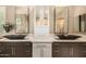 Bathroom with dual sinks, modern vanity, and framed mirrors at 11124 N 138Th Way, Scottsdale, AZ 85259