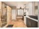 Spacious bathroom featuring a walk-in shower, soaking tub, dual sinks, and neutral stone tile throughout at 11124 N 138Th Way, Scottsdale, AZ 85259