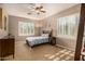 Cozy bedroom with plantation shutters allowing plenty of natural light at 11124 N 138Th Way, Scottsdale, AZ 85259