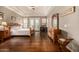 Spacious main bedroom with beautiful hardwood floors, tray ceilings, and French doors leading to the patio at 11124 N 138Th Way, Scottsdale, AZ 85259
