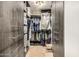 Walk-in closet with custom shelving and drawers, maximizing storage and organization at 11124 N 138Th Way, Scottsdale, AZ 85259