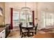 Cozy dining area with a decorative chandelier, views, and plenty of natural light at 11124 N 138Th Way, Scottsdale, AZ 85259