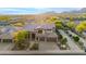 Expansive home with three car garage, desert landscaping and sunset mountain views at 11124 N 138Th Way, Scottsdale, AZ 85259