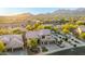 A stunning exterior view of a multi-story home in a beautiful desert community with mountain views at sunset at 11124 N 138Th Way, Scottsdale, AZ 85259