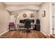 Well-appointed home office featuring a spacious desk, hardwood floors, and ambient lighting at 11124 N 138Th Way, Scottsdale, AZ 85259