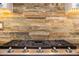 Close up of cooktop and stone backsplash at 11124 N 138Th Way, Scottsdale, AZ 85259