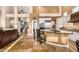 Open kitchen with a curved island, bar seating, and stainless steel appliances at 11124 N 138Th Way, Scottsdale, AZ 85259
