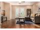 Comfortable living room showcasing hardwood floors, a cozy sofa, and access to an outdoor patio at 11124 N 138Th Way, Scottsdale, AZ 85259