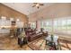 Inviting living room with kitchen view, island seating, and plentiful natural light at 11124 N 138Th Way, Scottsdale, AZ 85259
