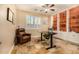 Home office featuring custom built-ins, natural light, and a comfortable workspace at 11124 N 138Th Way, Scottsdale, AZ 85259
