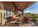 Relax on this covered patio with stylish furniture and stunning views of the meticulously landscaped backyard oasis at 11124 N 138Th Way, Scottsdale, AZ 85259