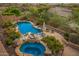 Custom pool and spa with lush landscaping and rock features, creating a serene outdoor retreat at 11124 N 138Th Way, Scottsdale, AZ 85259