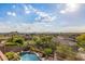 Aerial view of a backyard with a stunning pool, spa, and desert landscaping, offering a tranquil outdoor oasis at 11124 N 138Th Way, Scottsdale, AZ 85259