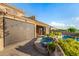 Backyard featuring a pool, hot tub and patio shaded by automated blinds, with lush desert landscaping at 11124 N 138Th Way, Scottsdale, AZ 85259