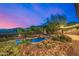 A backyard pool and spa with a built in grill on a desert landscaped lot with mountain views at 11124 N 138Th Way, Scottsdale, AZ 85259