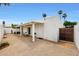 Private backyard featuring a covered patio, gravel landscaping, and secure gated access at 1122 E Michelle Dr, Phoenix, AZ 85022