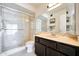 Well-lit bathroom featuring a walk-in shower and sleek vanity at 1122 E Michelle Dr, Phoenix, AZ 85022