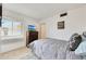 Cozy bedroom featuring a twin bed, neutral color palette, and ample natural light from the window at 1122 E Michelle Dr, Phoenix, AZ 85022