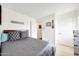 Comfortable bedroom with plush bed, soft lighting, and neutral tones create a tranquil retreat at 1122 E Michelle Dr, Phoenix, AZ 85022