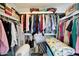 Walk-in closet with an organized shelving system providing ample storage space at 1122 E Michelle Dr, Phoenix, AZ 85022