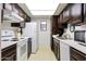 Efficient kitchen featuring ample counter space, classic appliances, and plenty of storage at 1122 E Michelle Dr, Phoenix, AZ 85022