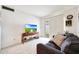 Bright living room with neutral carpet, sliding door, and console table at 1122 E Michelle Dr, Phoenix, AZ 85022