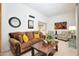 Cozy living room with plush sofa, stylish armchairs, and a warm, inviting ambiance at 1122 E Michelle Dr, Phoenix, AZ 85022
