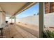 The covered patio overlooks a low maintenance yard with seating, ideal for relaxing outdoors at 1122 E Michelle Dr, Phoenix, AZ 85022