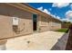 The back patio features tan stucco, tile flooring, a glass slider, and artificial turf at 12289 E Ballentine Rd, Gold Canyon, AZ 85118