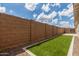This home has a backyard with artificial turf, stone accents and a brick fence at 12289 E Ballentine Rd, Gold Canyon, AZ 85118
