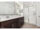 Modern bathroom featuring double sinks, white countertops, and a glass-enclosed shower at 12289 E Ballentine Rd, Gold Canyon, AZ 85118