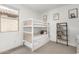 Bright bedroom with a bunk bed, bookshelf, and neutral decor, perfect for  at 12289 E Ballentine Rd, Gold Canyon, AZ 85118