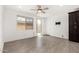 Bedroom featuring a ceiling fan, window, door to patio, and a closet at 12289 E Ballentine Rd, Gold Canyon, AZ 85118