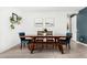 Inviting dining area with wooden table, blue chairs, and tile flooring at 12289 E Ballentine Rd, Gold Canyon, AZ 85118