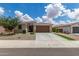 Charming single-story home featuring a well-manicured yard, neutral colors and a two car garage at 12289 E Ballentine Rd, Gold Canyon, AZ 85118