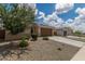Well-maintained single-story home featuring desert landscaping, a two car garage, and neutral colors at 12289 E Ballentine Rd, Gold Canyon, AZ 85118