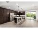 Modern kitchen features stainless steel appliances, a center island, and sleek dark cabinetry at 12289 E Ballentine Rd, Gold Canyon, AZ 85118