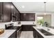 Gourmet kitchen featuring stainless steel appliances and dark wood cabinets at 12289 E Ballentine Rd, Gold Canyon, AZ 85118