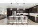 Modern kitchen features a spacious island, stainless steel appliances, and dark cabinetry at 12289 E Ballentine Rd, Gold Canyon, AZ 85118