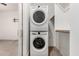 Convenient laundry room with a stacked washer and dryer, providing functionality in a compact space at 12289 E Ballentine Rd, Gold Canyon, AZ 85118