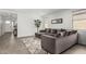 Cozy living area with a plush sectional sofa, decorative rug, and a view of the entryway at 12289 E Ballentine Rd, Gold Canyon, AZ 85118