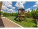 Backyard play area with an artificial lawn and wooden playset creating fun and safety at 12289 E Ballentine Rd, Gold Canyon, AZ 85118