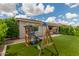 Backyard with an artificial turf and wooden playset, creating a fun and safe play area at 12289 E Ballentine Rd, Gold Canyon, AZ 85118