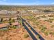 An aerial view showing desert community with a shopping center at 12605 E Kalil Dr, Scottsdale, AZ 85259