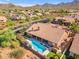 Aerial view of house showcasing pool, landscape and patio at 12605 E Kalil Dr, Scottsdale, AZ 85259