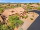 Aerial view of a home with desert landscaping showcasing the property's layout and community setting at 12605 E Kalil Dr, Scottsdale, AZ 85259