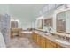 Elegant bathroom featuring a soaking tub, double sink vanity, and a glass block shower at 12605 E Kalil Dr, Scottsdale, AZ 85259