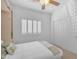Comfortable bedroom features carpet flooring, a window with shutters, and a sliding-door closet at 12605 E Kalil Dr, Scottsdale, AZ 85259