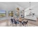Bright dining area with fireplace, plenty of natural light and access to the adjacent living area at 12605 E Kalil Dr, Scottsdale, AZ 85259